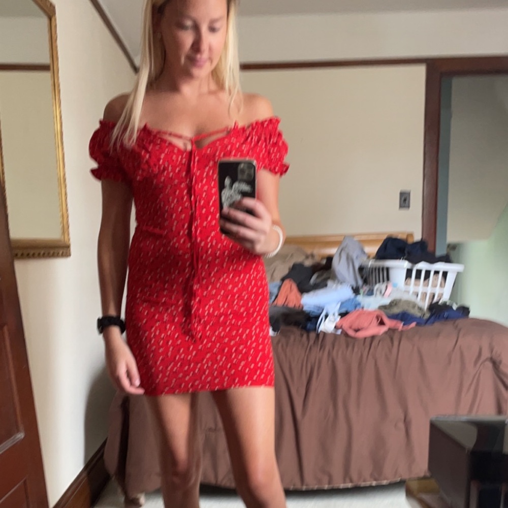 Red off the shoulder bodycon dress.